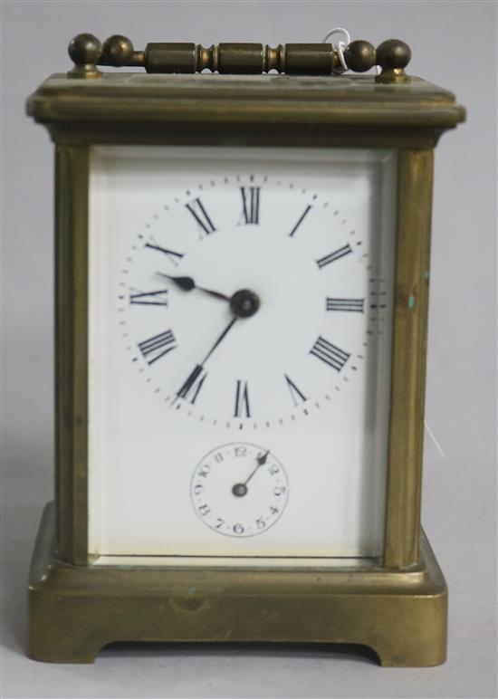 A brass carriage timepiece with alarm